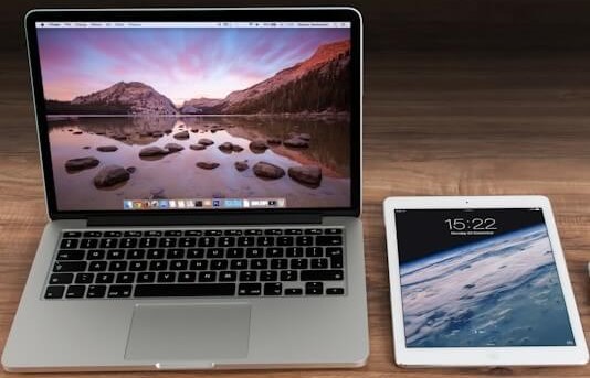 Modern laptop and tablet on a desk ready for work and study